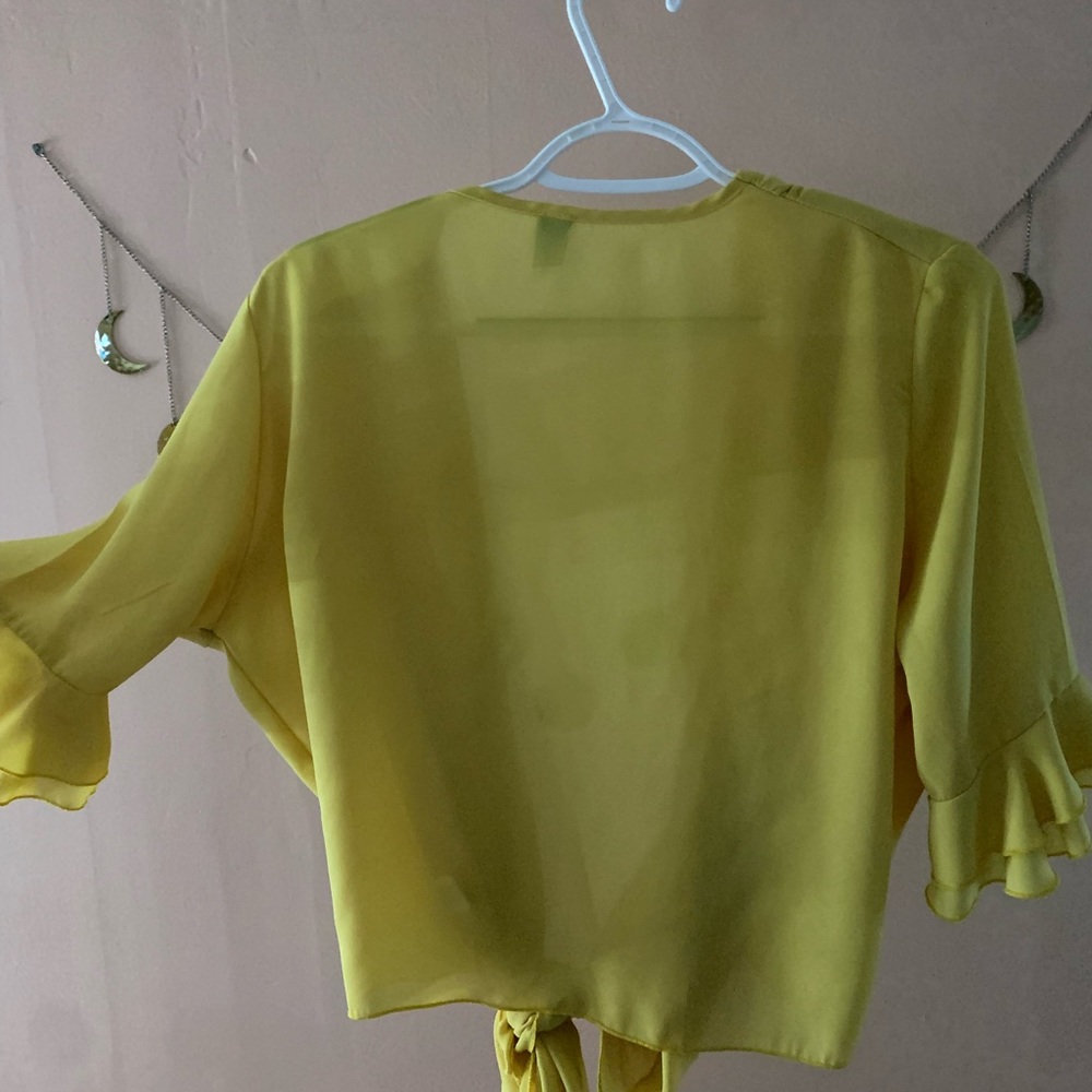 Yellow tie-front shirt with ruffle sleeves